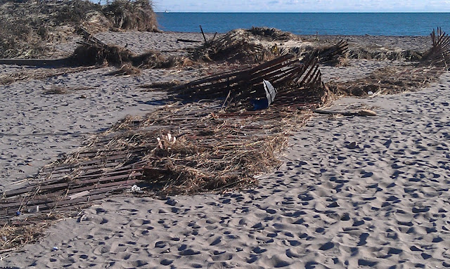 broken fence at beach