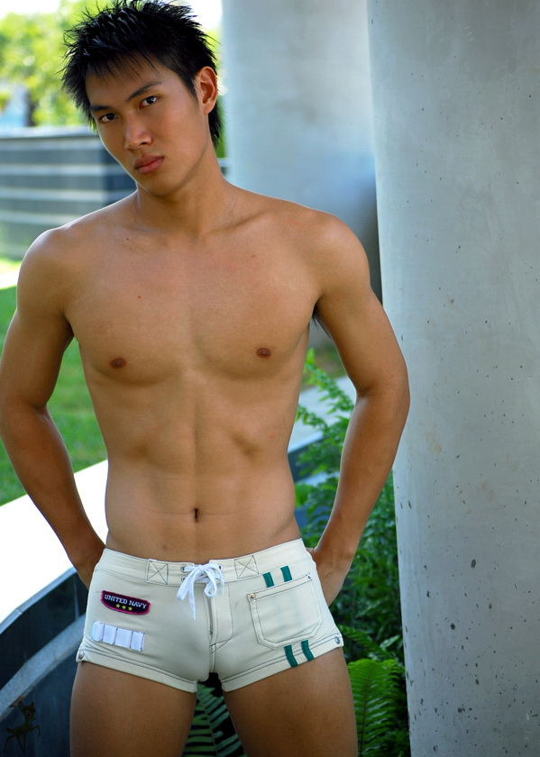 Hot Asian lad in snug short shorts.