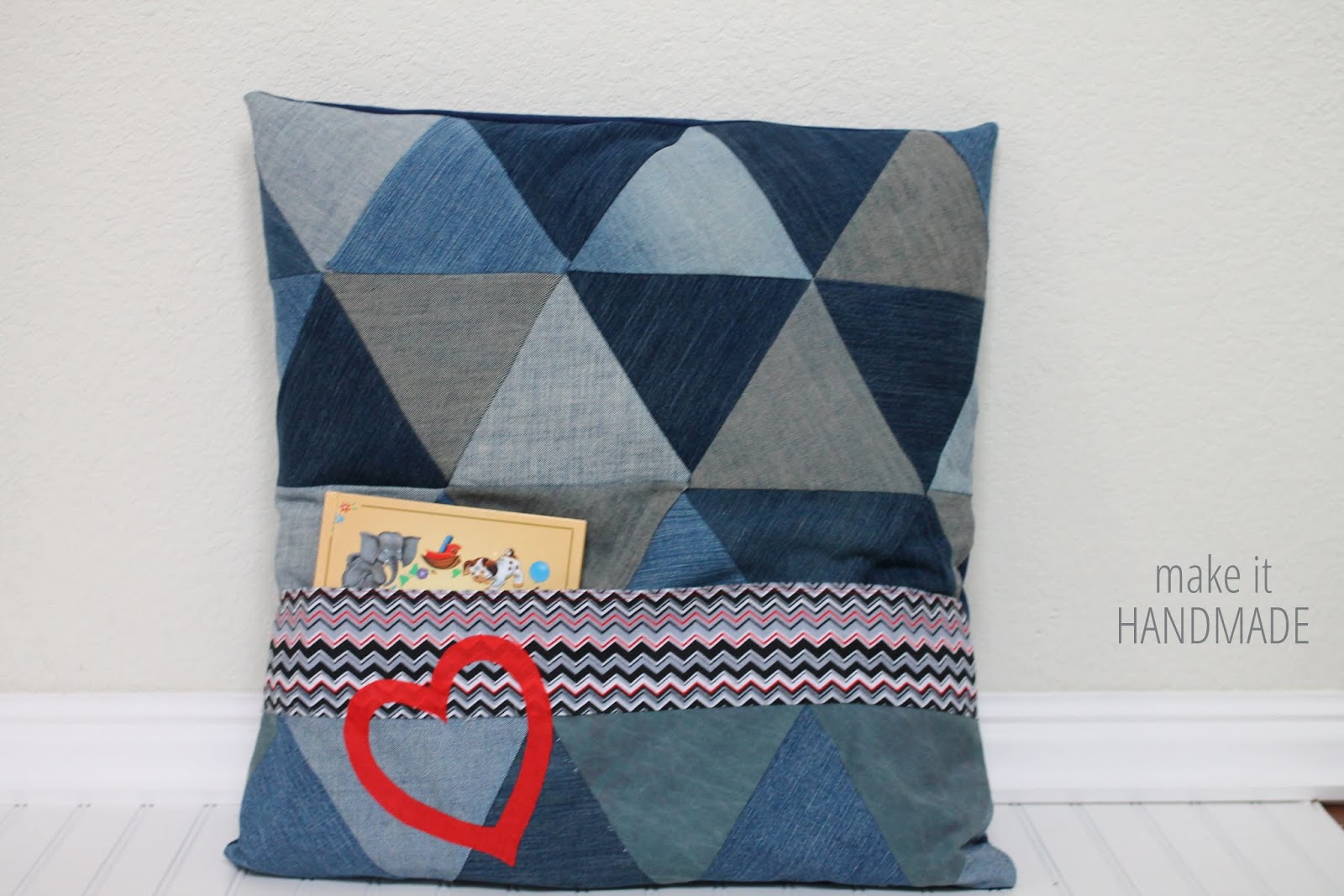 The Read To Me Pillow, a DIY sewn pillow that's big enough for two to share and has a pocket to hold your favorite bed time stories. 