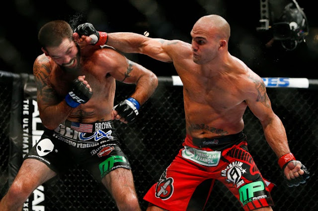 Photo credit: Esther Lin MMA Fighting Robbie Lawler punch Matt Brown in UFC on Fox 12