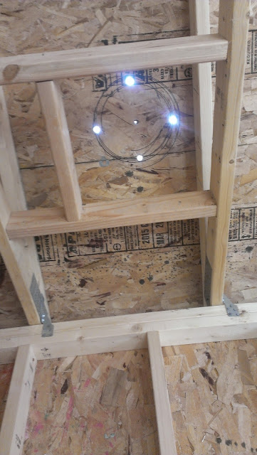 Marking the roof opening for the chimney and drilling starter holes. Marking the roof opening for the chimney and drilling starter holes.