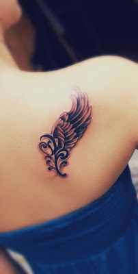 Angel wing tattoo on the right shoulder