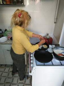 Ms Zulya the stewardess cum cook preparing our breakfast in "Trip LE" guesthouse.