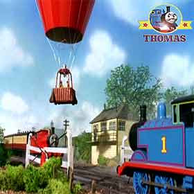 Percy Thomas tank engine James and the red balloon waiting at a the train railway crossing in Sodor