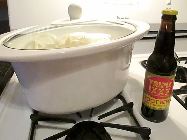 Triple XXX Root Beer and a pork roast with seasoning and onions. Triple XXX Root Beer and a pork roast with seasoning and onions.