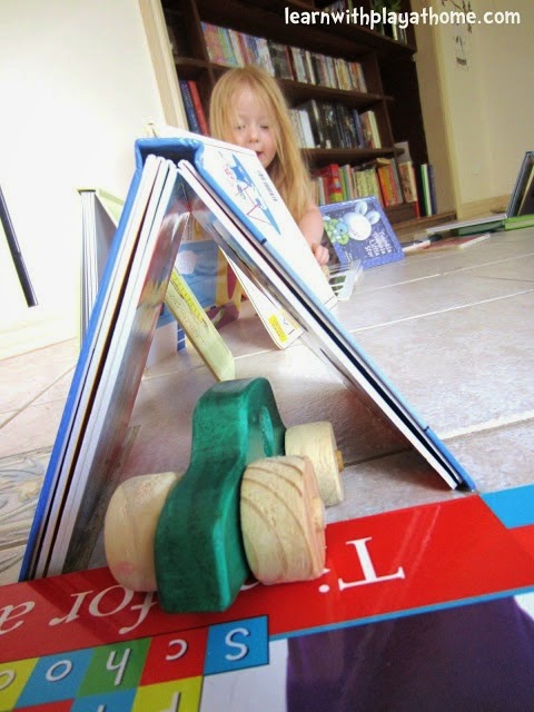 http://www.learnwithplayathome.com/2012/10/building-playing-with-books-cars.html