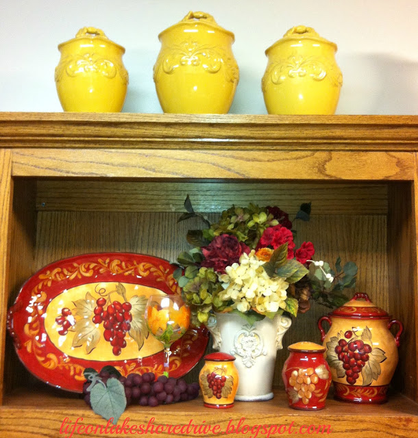 Red and gold kitchen vignette  gold cannisters