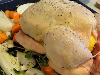uncooked chicken in roasting pan ready to be cooked