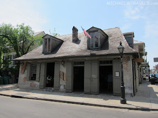 Lafitte's Blacksmith Shop with a flag on the roof