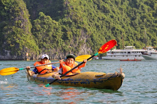 Children kayaking in Halong Bay