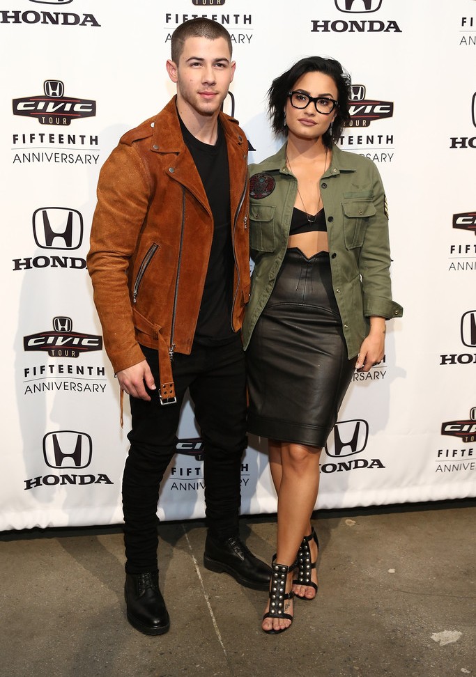 Fashion For Men Nick Jonas Is Casually Cool In Amiri Suede Biker Jacket The Levels Singer Wore A Brown Suede Biker Jacket And Black Denim Jeans From Amiri Los Angeles Based Label By Mike Brand Brings Youthful
