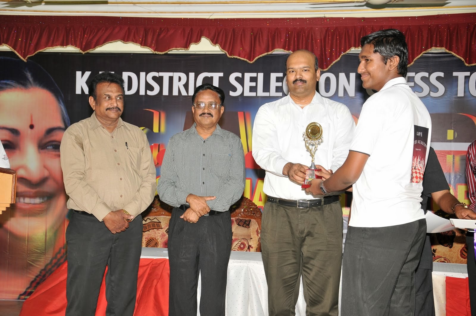 NISHVIN RECEIVE TROPHY BY DISTRICT COLLECTOR