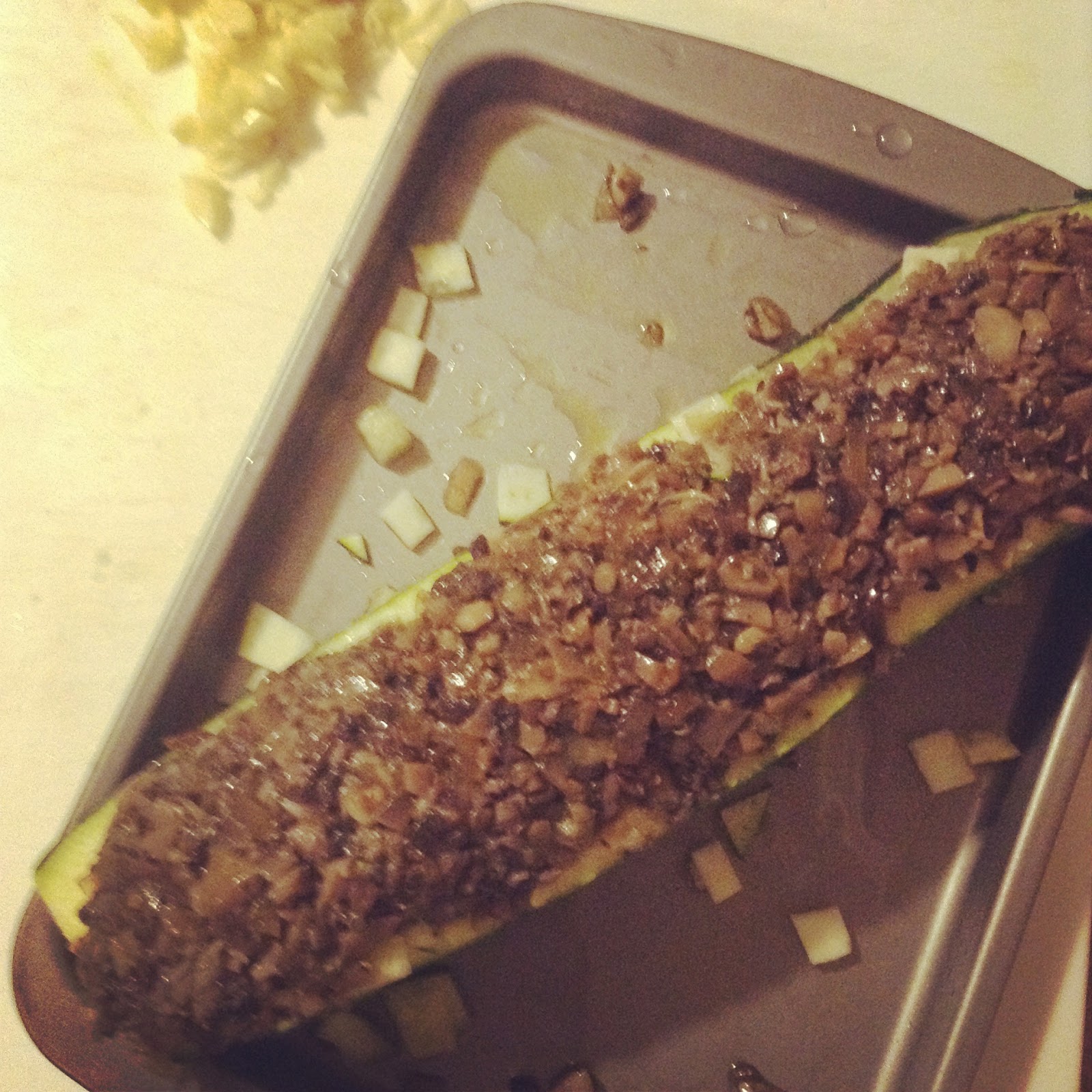 Zucchini stuffed with leftover mushroom mince Zucchini stuffed with leftover mushroom mince on a baking tray