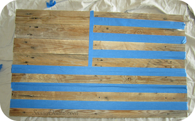 taping the wood pallet to make an american flag