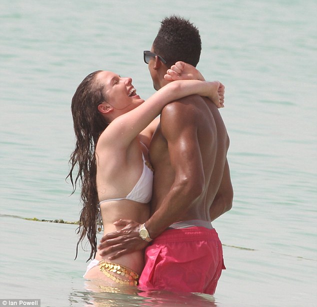 Helen_Flanagan_shows_off_curves_tight_white_bikini_cavorts_sea_Scott_Sinclair_4.jpg