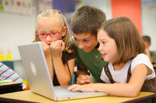 Photo from teach vibes.com Children playing on a computer