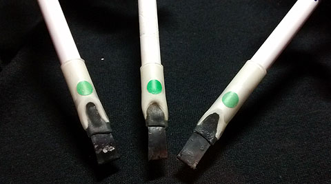 zSticks Ultra-sensitive sensors, that can be used as on/off switches, or analogue controls. Black rubber tips, attached to white plastic narrow cylinders. Each with a green round sticker on them.