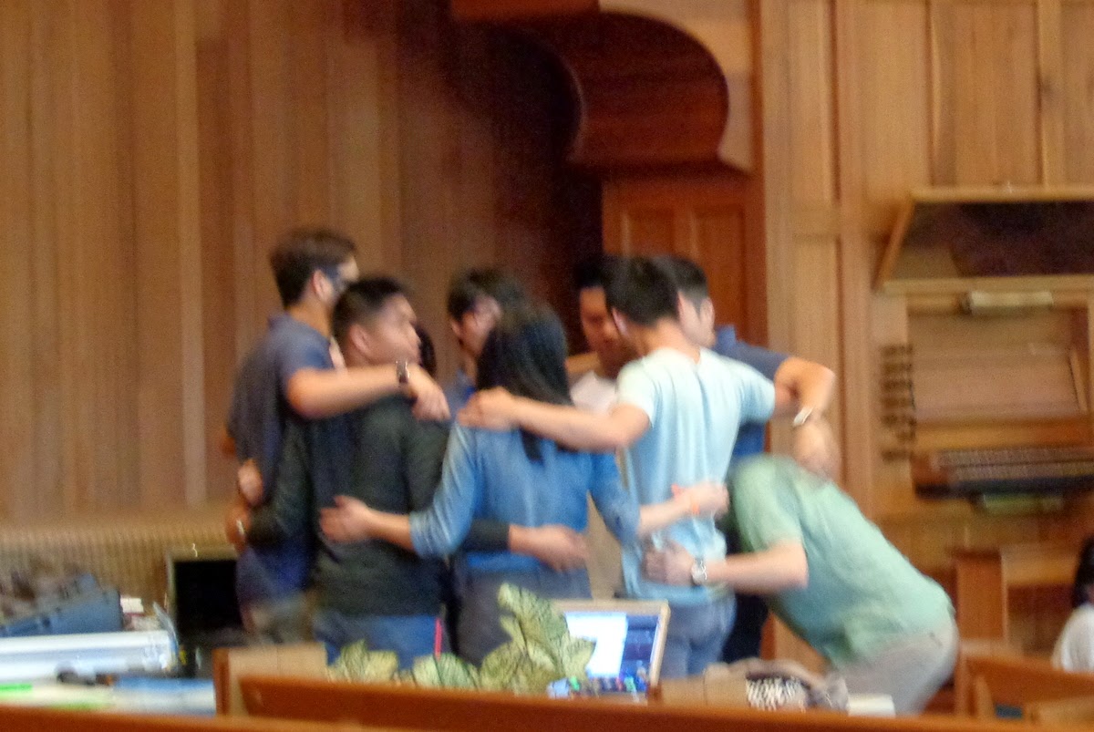 worship team praying together before service