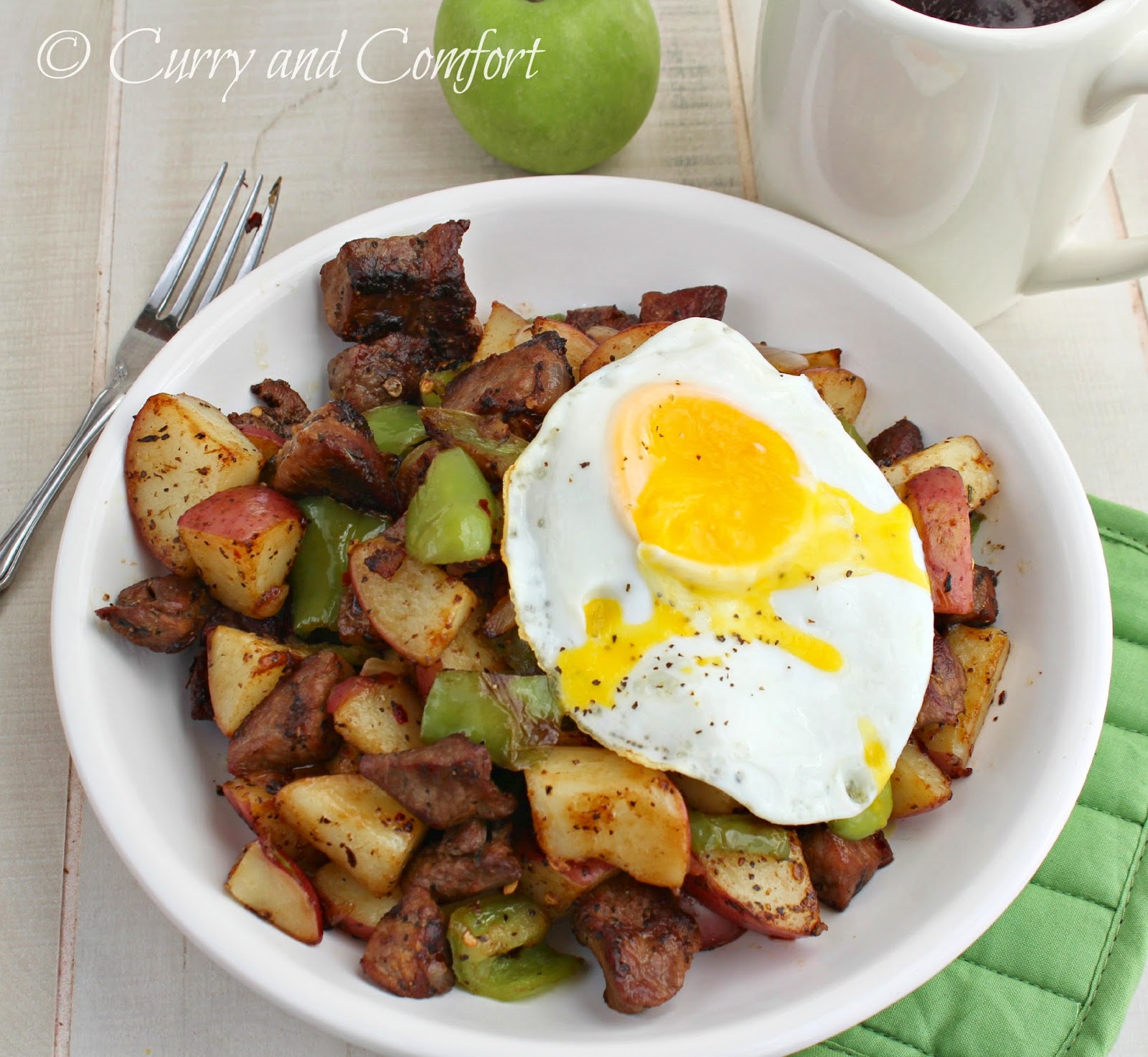 Kitchen Simmer Steak and Potato Hash Topped with a Fried Egg