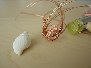 In progress woven wire frame for white nutmeg shell handcrafted by Vicky Brown of Shore Debris