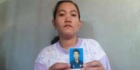 Eni Nurida (33), memperlihatkan foto Dedi Setyawan (35) alias Didik di rumahnya
