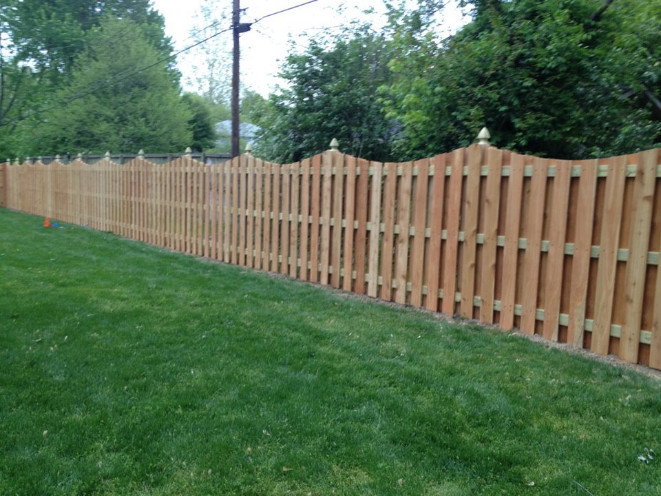 K & M Fence 6' Tall Cedar Concave Shadow Box Fence using French Gothic Posts.