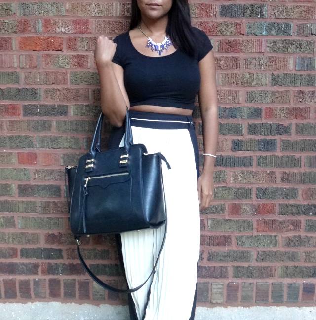 pleated pants and blue necklace