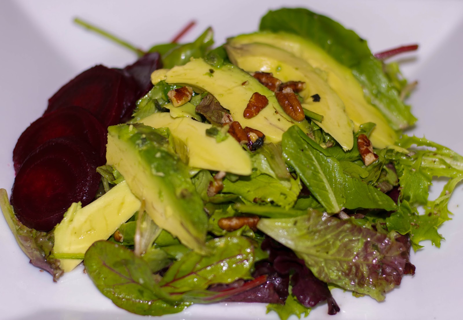 Carrie's Experimental Kitchen Mixed Greens with Avocado and Beets in a