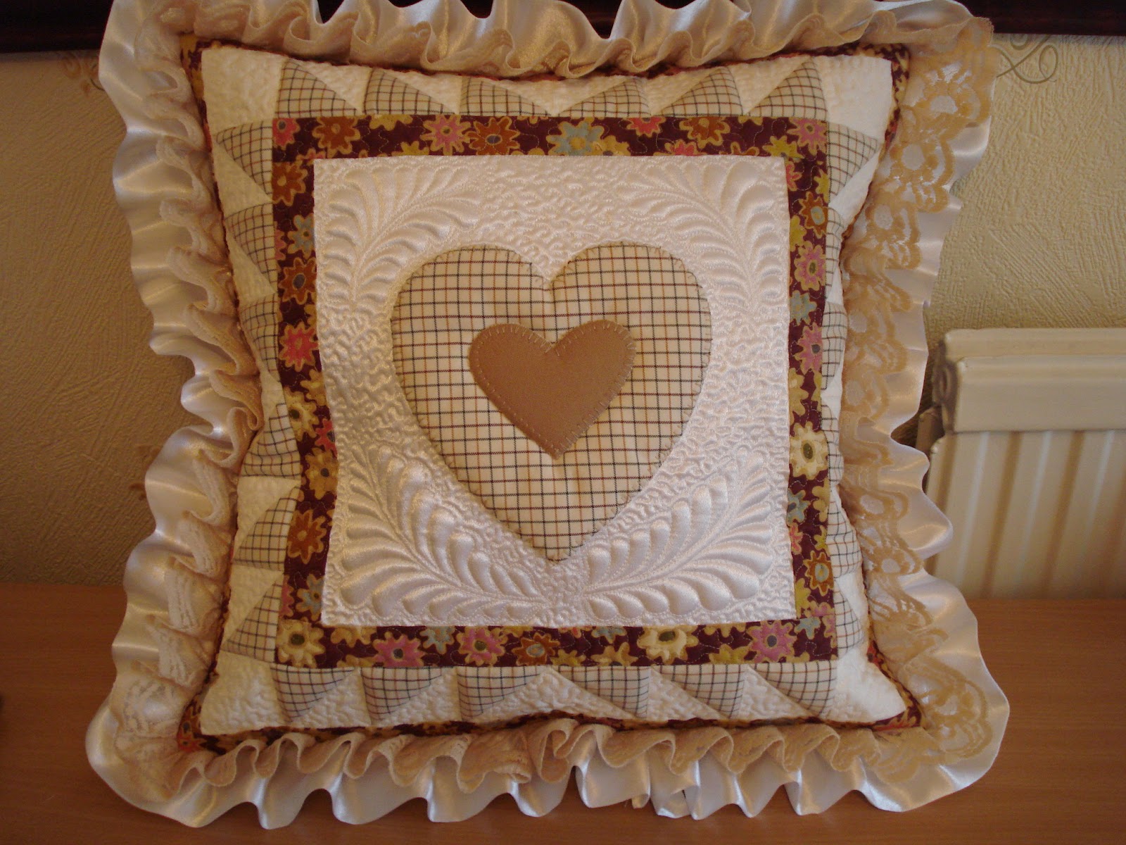 The Nifty Stitcher Memory Cushions with Quilted Feathers.