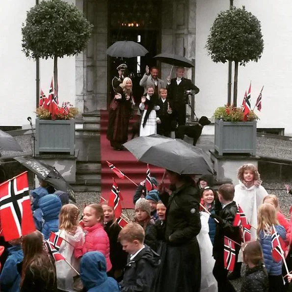 Crown Prince Haakon of Norway and Crown Princess Mette-Marit of Norway with Princess Ingrid Alexandra, Prince Sverre Magnus and Marius Borg Høiby greet the Childrens Parade on the Skaugum Estate 