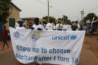 Gambian youth vocalize their stance on child/forced marriage during an awareness raising march through Basse, The Gambia in October 2011.