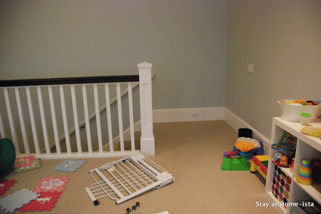 installing a baby gate perpendicular to the top of the stairs