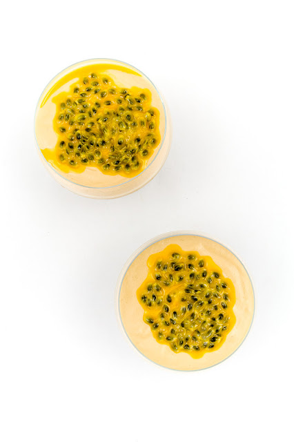 Raw mango and coconut cream with passion fruit shot from above