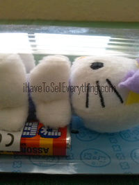 Hello Kitty Pez dispenser plush Easter Bunny lying down from side view Hello Kitty Pez dispenser plush Easter Bunny lying down from side view
