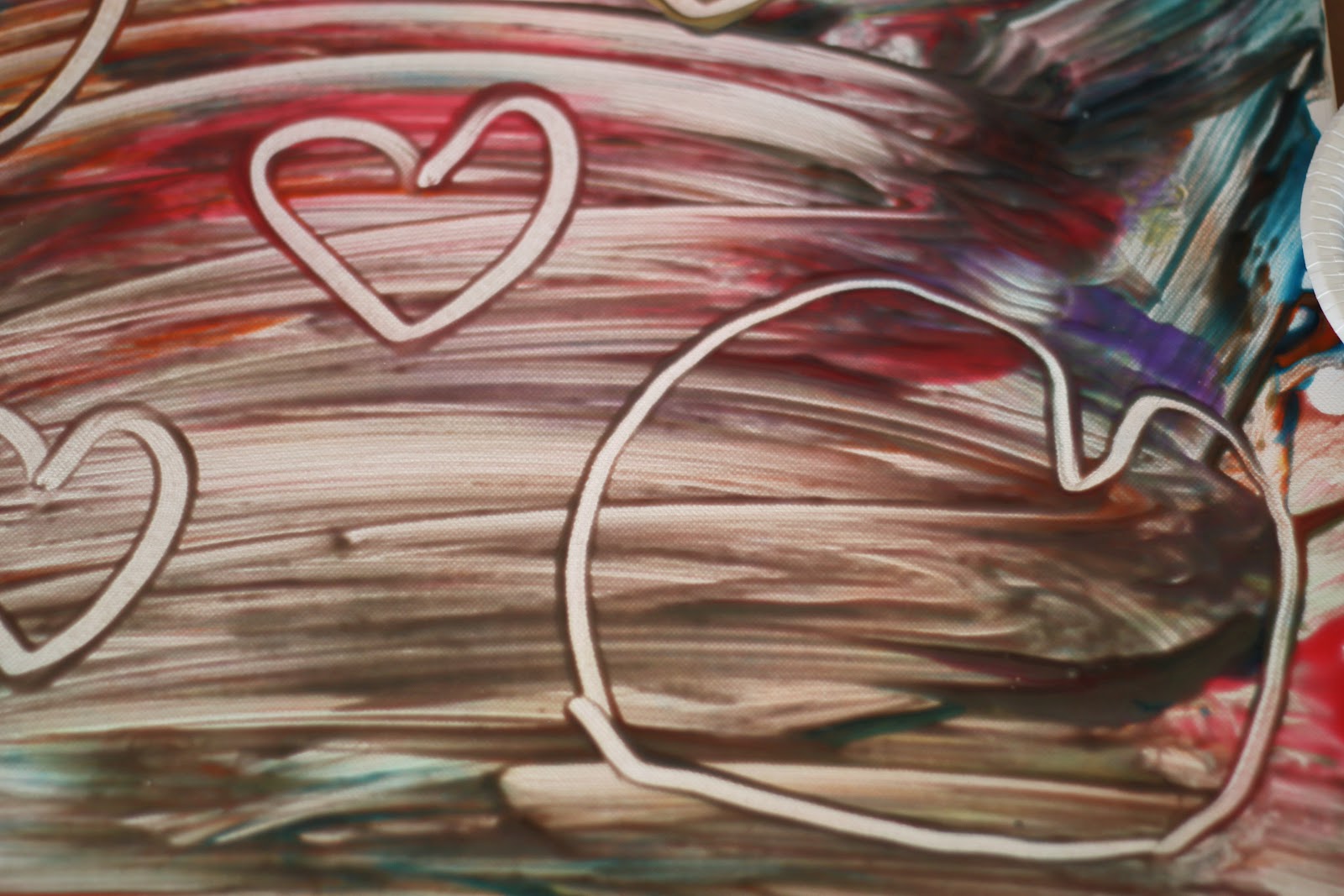 Playing House Finger Painting on a Canvas