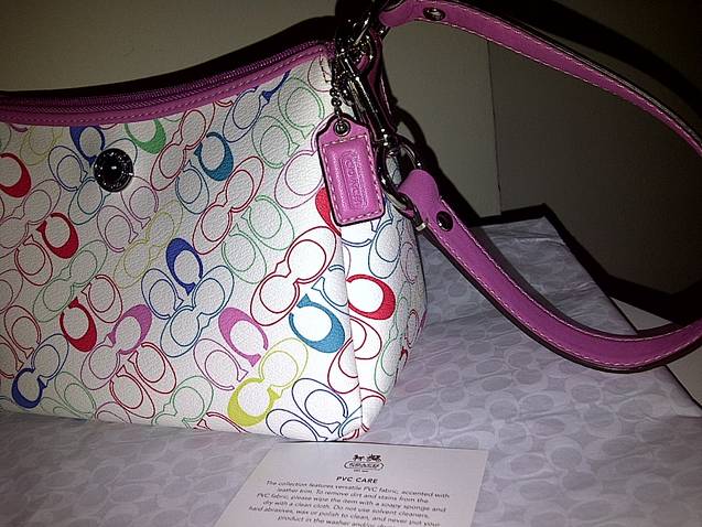 white coach purse with colored c's