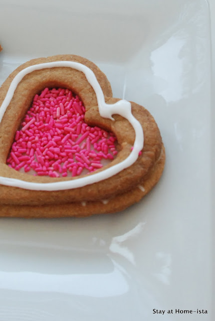 heart sandwich cookie with pink sprinkle center
