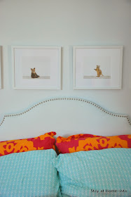 Animal Print Shop baby animal prints over a bed