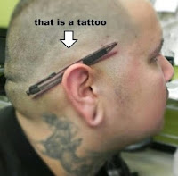 funny clever tattoo of ballpoint pen behind mans ear body art piercing