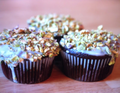 Balancing Bites-Chocolate chocolate chip cupcakes with a glaze icing and pistachios