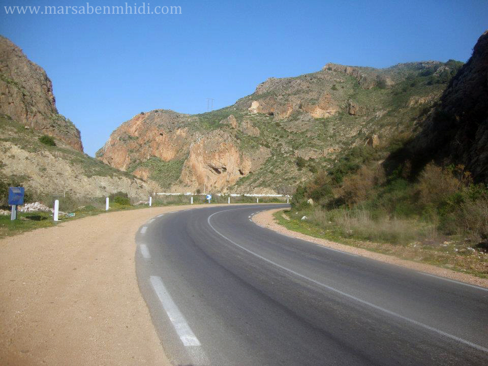 Road+between+mountain+cliff.jpg