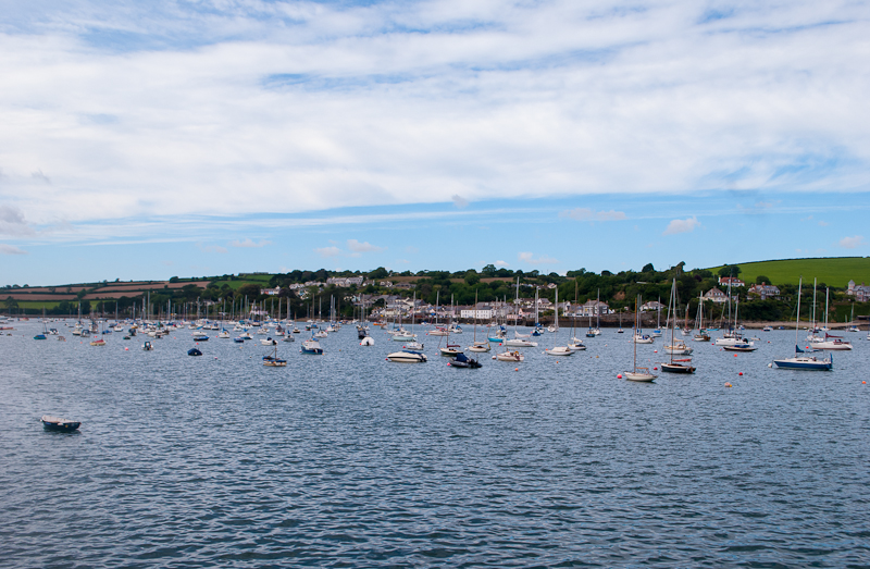 Boats floating along the water of the harbour in falmouth, cornwall, england. Boats floating along the water of the harbour in falmouth, cornwall, england.