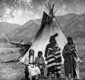 Flathead family in front of teepee Plateau People of America
