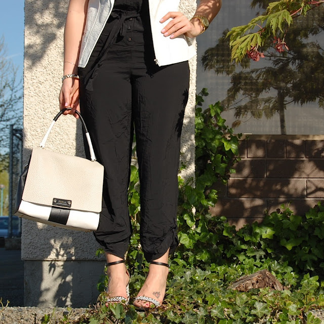 Stylestalker white leather vest, black jumpsuit and Zara sandals