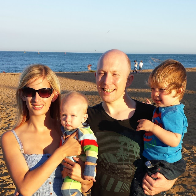 family photo, photo at the beach, family of four