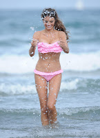 Chloe Sims splashes in a pink two piece bikini