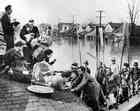 black and white photo of people being rescued during the 1937 flood in louisville ky