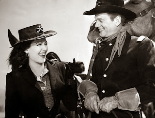 Linda Darnell and Joseph Cotten have a laugh between scenes of Two Flags West