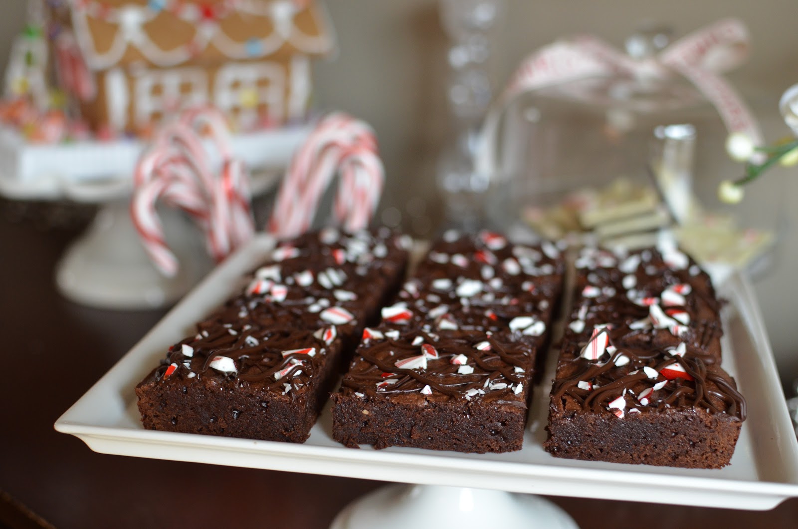 Playing with Flour Peppermint brownies topped with candy cane and dark