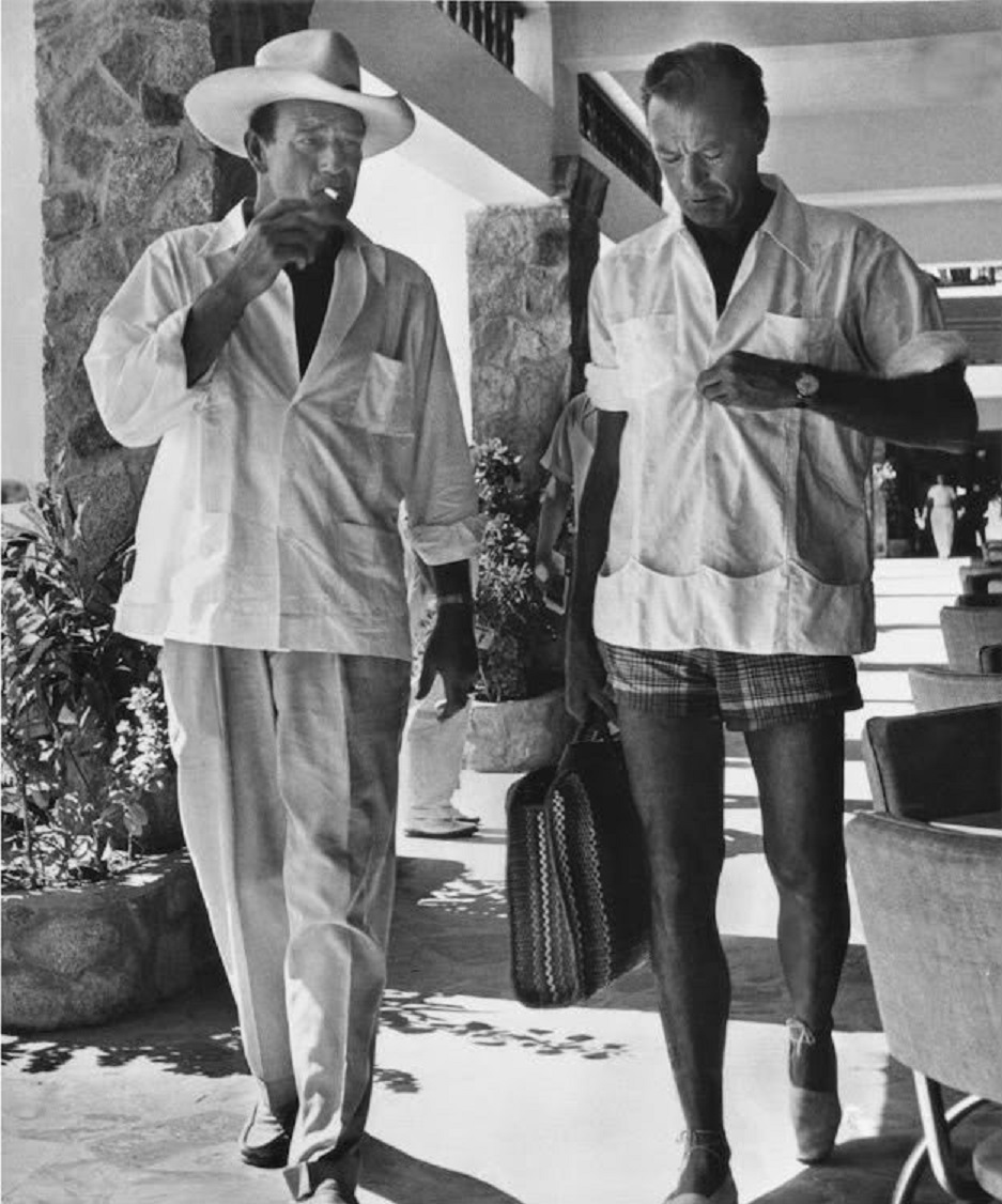 John Wayne visited with Gary Cooper.